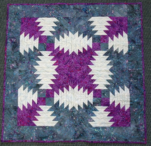 blue purple and white star quilt
